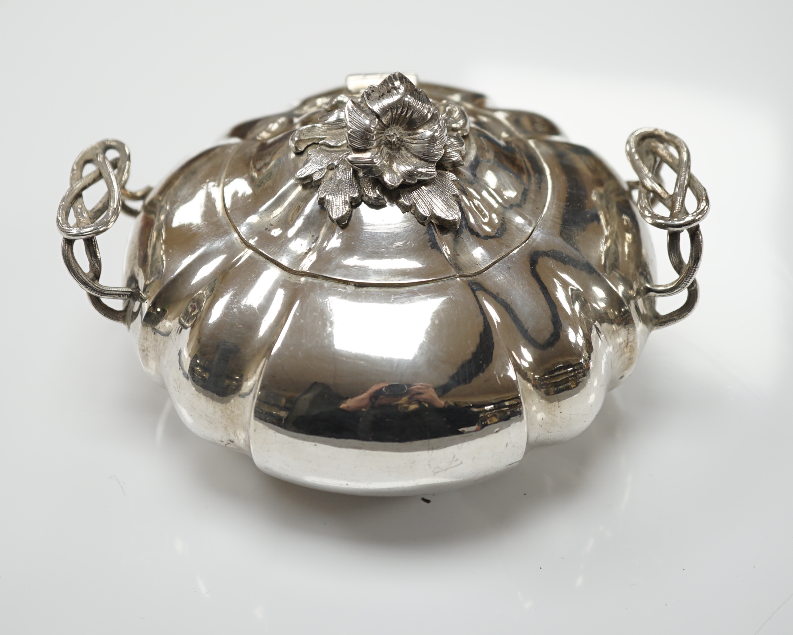 A mid 19th century Russian 84 zolotnik two handle sugar bowl and hinged cover, assay master possibly Vasily Surotsov, width over handles, 13.5cm, 10oz.